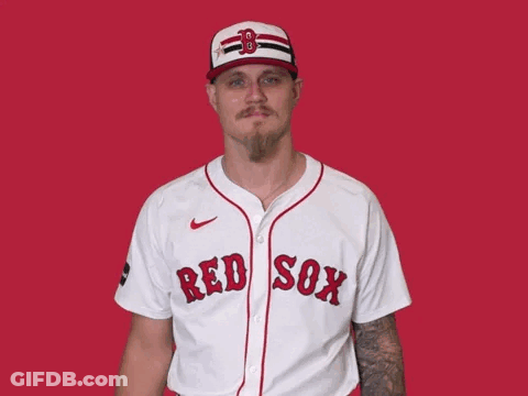 A Man Is Wearing A Red Sox Jersey And Waving GIF