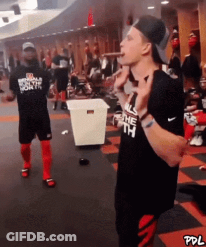 A Man Is Wearing A Shirt That Says All The North On It GIF