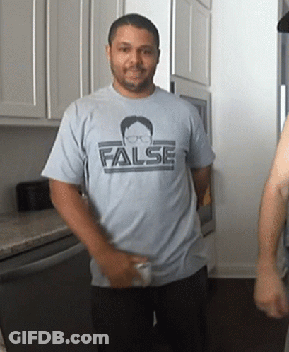 A Man Is Wearing A Shirt That Says False On It GIF