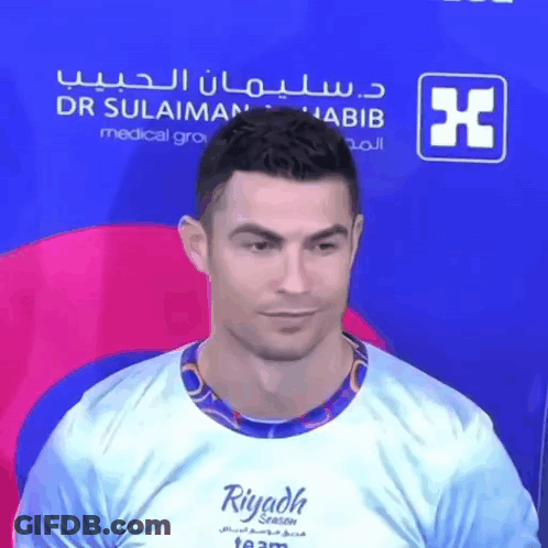 A Man Is Wearing A Shirt That Says Riyadh Season GIF