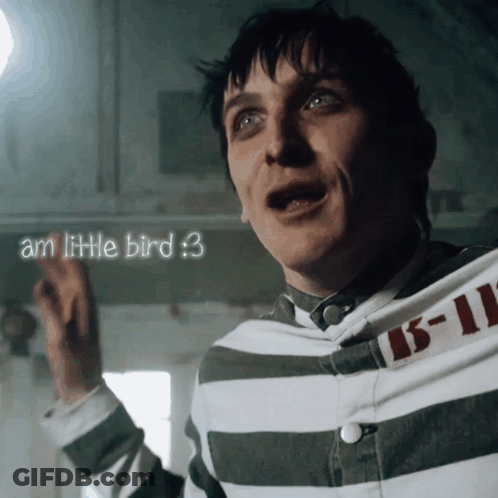 A Man Is Wearing A Striped Shirt With The Number 15-11 On The Sleeve GIF