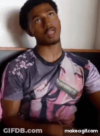 A Man Is Wearing A T-Shirt With A Picture Of A Girl On It . GIF