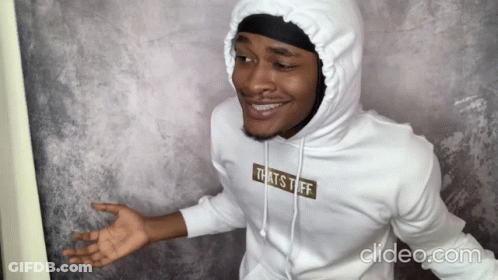 A Man Is Wearing A White Hoodie That Says That 'S Tuff GIF