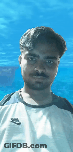 A Man Is Wearing A White Nike Shirt GIF