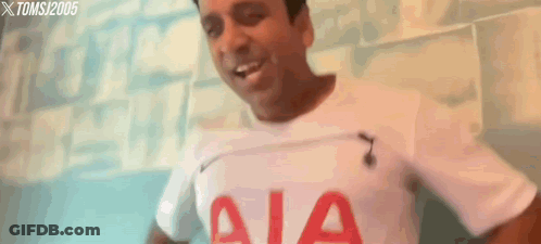 A Man Is Wearing A White Shirt With Aia On It GIF