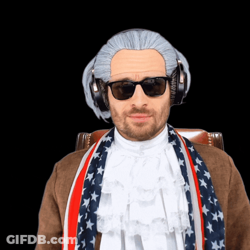 A Man Is Wearing A Wig And Sunglasses And Has A Scarf Around His Neck GIF
