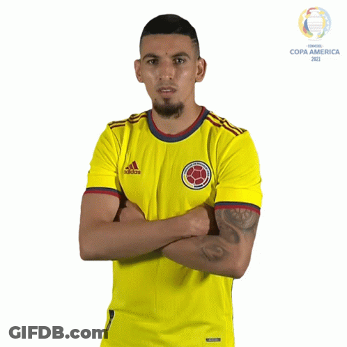 A Man Is Wearing A Yellow Adidas Shirt GIF