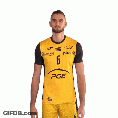 A Man Is Wearing A Yellow And Black Pge Plus Shirt GIF