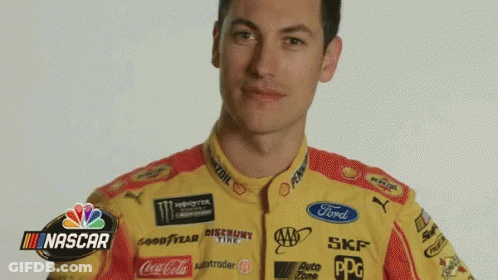 A Man Is Wearing A Yellow And Red Nascar Shirt GIF