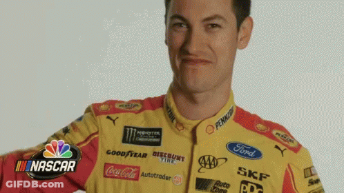 A Man Is Wearing A Yellow And Red Racing Uniform With Nascar Logos On It GIF