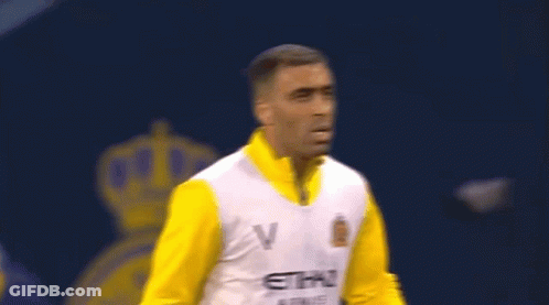 A Man Is Wearing A Yellow And White Etihad Airways Jersey GIF