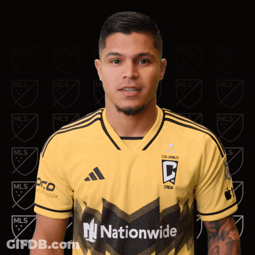 A Man Is Wearing A Yellow Jersey That Says Columbus Crew On It GIF