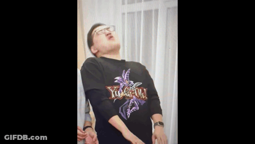 A Man Is Wearing A Yu Gi Oh Shirt GIF