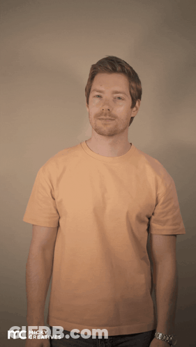 A Man Is Wearing An Orange Shirt That Says Yes Queen Slay GIF