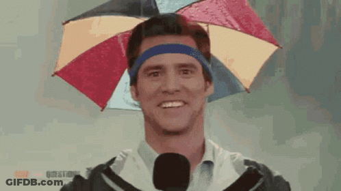 A Man Is Wearing An Umbrella On His Head GIF