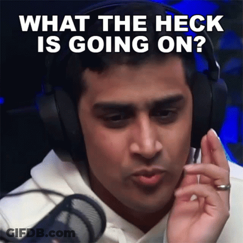 A Man Is Wearing Headphones And Asking What The Heck Is Going On GIF
