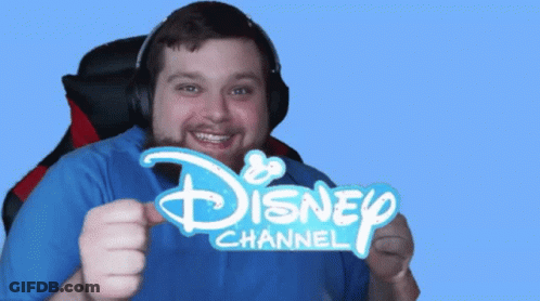 A Man Is Wearing Headphones And Holding A Disney Channel Sign GIF