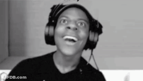 A Man Is Wearing Headphones And Making A Funny Face . GIF