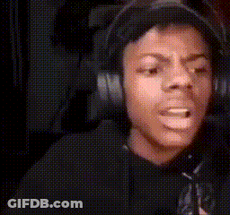 A Man Is Wearing Headphones And Making A Funny Face . GIF