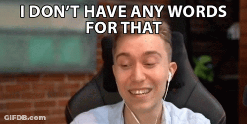 A Man Is Wearing Headphones And Smiling While Sitting In A Chair . GIF