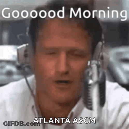 A Man Is Wearing Headphones And Talking Into A Microphone While Saying Good Morning Atlanta Ascm . GIF