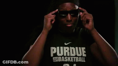 A Man Is Wearing Sunglasses And A Purdue Basketball Shirt GIF