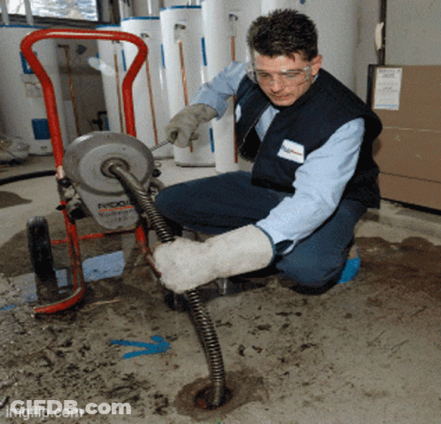 A Man Is Working On A Machine That Says Ridgid GIF