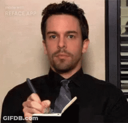 A Man Is Writing In A Notebook With A Pen . GIF