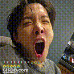 A Man Is Yawning With His Mouth Open In A Pixelated Photo . GIF