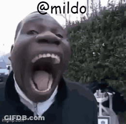 A Man Is Yawning With His Mouth Wide Open And His Tongue Hanging Out . GIF