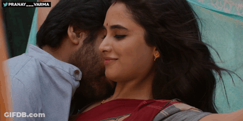 A Man Kisses A Woman On The Forehead With The Hashtag Pranay_varma On The Bottom GIF