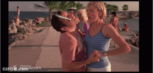A Man Kissing A Woman On The Cheek In A Movie Clip GIF