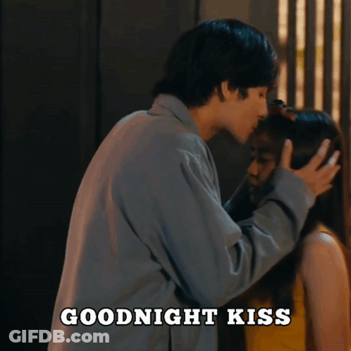 A Man Kissing A Woman 'S Forehead With The Words Goodnight Kiss Above Them GIF