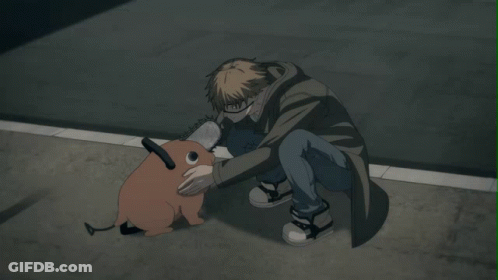 A Man Kneeling Down With A Chainsaw Dog GIF