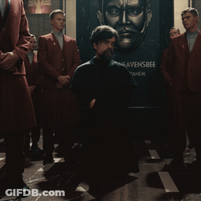 A Man Kneeling In Front Of A Heavensbee Sign GIF