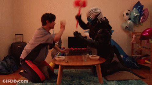 A Man Kneeling Next To A Monster With A Hammer GIF