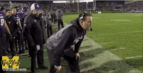 A Man Kneeling On A Football Field With A Goblog Logo On The Bottom GIF