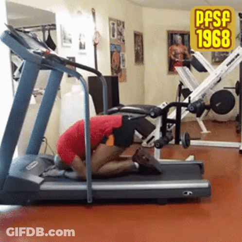 A Man Kneeling On A Treadmill In A Gym With The Year 1968 On The Bottom GIF