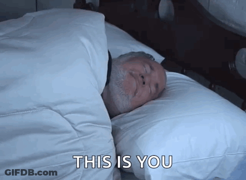 A Man Laying In A Bed With The Words This Is You Written Below Him GIF