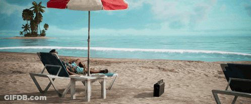 A Man Laying In A Chair Under An Umbrella On A Beach GIF