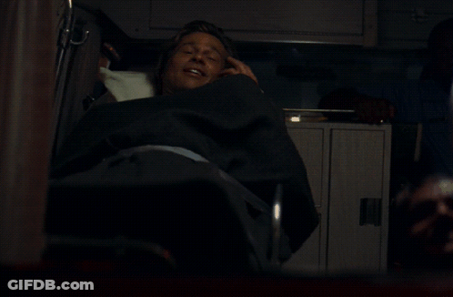 A Man Laying In A Chair With A Yellow I On It GIF