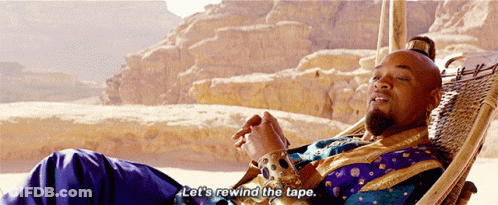 A Man Laying In A Hammock With The Words Let 'S Rewind The Tape Below Him GIF