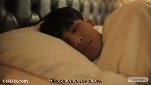 A Man Laying In Bed With The Words Please Leave Me Alone GIF