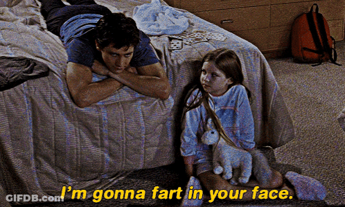 A Man Laying On A Bed Next To A Little Girl With The Words I 'M Gonna Fart In Your Face On The Bottom GIF