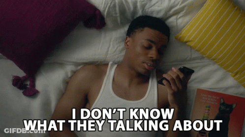 A Man Laying On A Bed Talking On A Cell Phone With The Words I Don 'T Know What They Talking About GIF