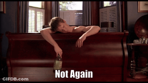 A Man Laying On A Bed With A Bottle Of Liquor And The Words Not Again Behind Him GIF