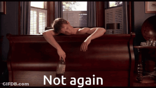 A Man Laying On A Bed With A Bottle Of Whiskey And The Words " Not Again " Above Him GIF