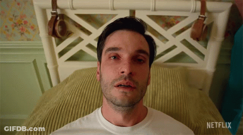 A Man Laying On A Bed With Netflix Written On The Bottom GIF