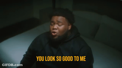 A Man Laying On A Bed With The Words You Look So Good To Me Below Him GIF