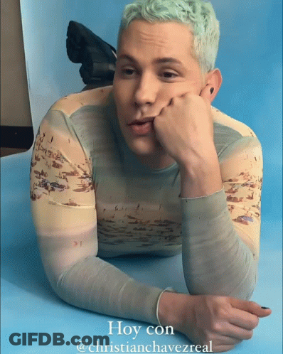 A Man Laying On A Blue Surface With The Caption Hoy Con @Christianchavezreal GIF